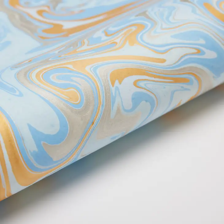 Papel de regalo marmolado azul claro